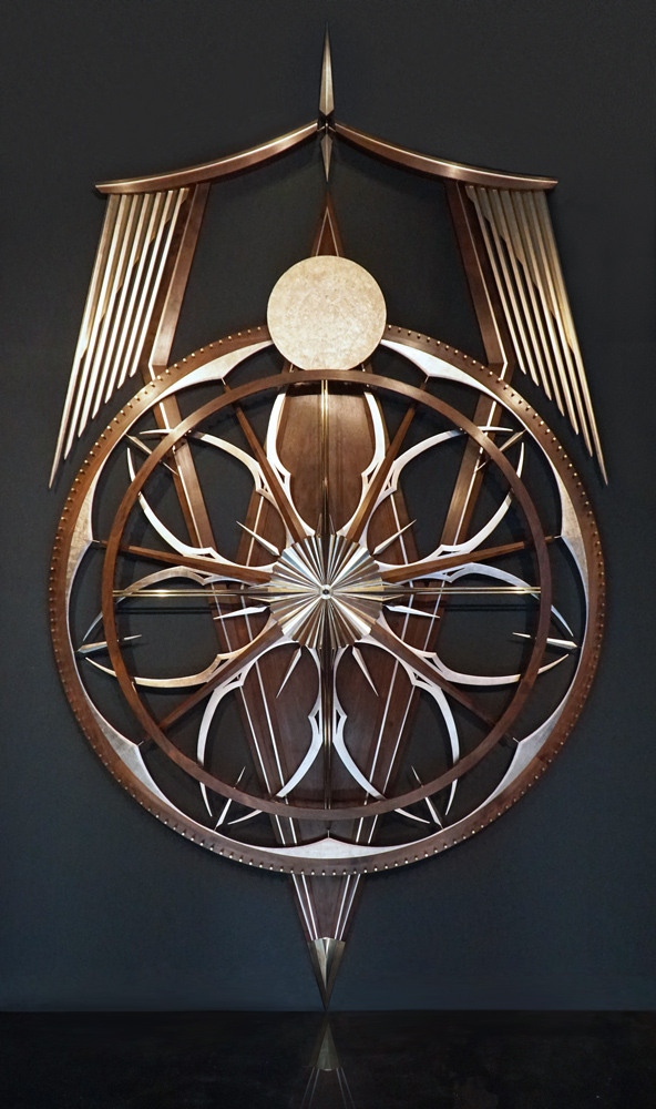 Origin, kinetic wallsculpture, walnut, brass and gold leaf.